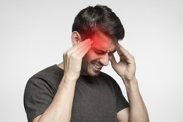 What are the symptoms of Nummular headache ?